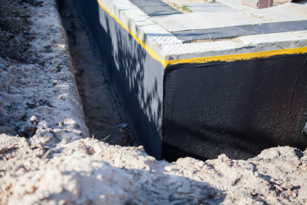 Professional Interior Drainage System technician working in East Northport, NY
